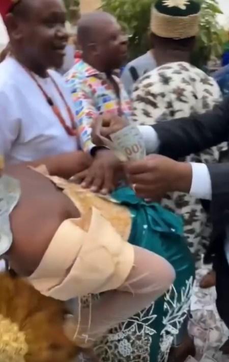 Moment Guest Stylishly Stole $100 Bill That Was Sprayed on Bride (Video)