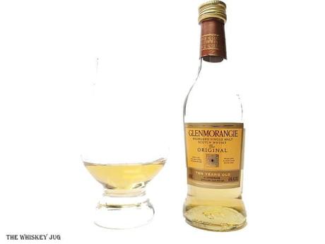 White background tasting shot with the Glenmorangie The Original 10 Years bottle and a glass of whiskey next to it.