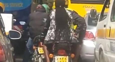 Motorcyclist And His Female Passenger Caught In Traffic Romance (Video)