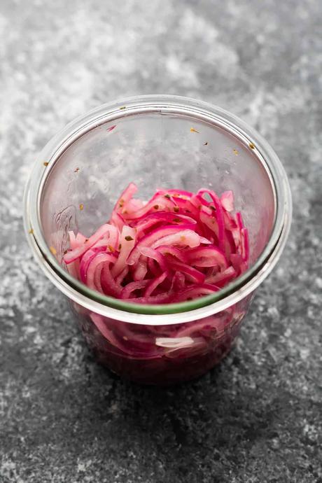 pickled red onions in jar from overhead