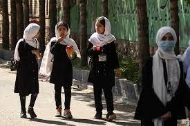 Afghan women react to Taliban allowing girls back in school as fears persist for their safety