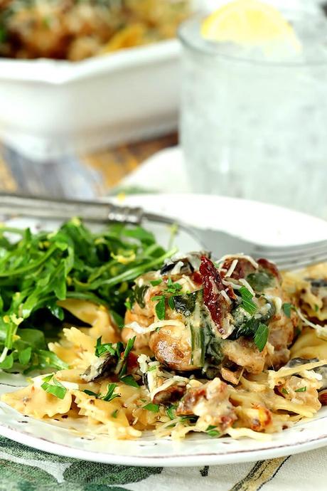 Chicken with Mushrooms, Sun-Dried Tomatoes, and Spinach in a Cream Sauce over Noodles