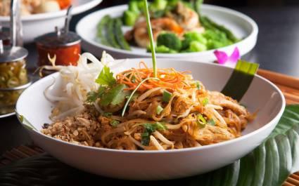 Chicken pad Thai with a variety of other fine Thai food dishes