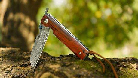 Best VG-10 steel survival:pocket knife- Tunafire Damascus Pocket Knife with background
