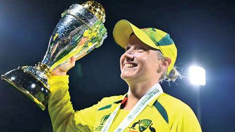 Australian wicket keeper and opener  Alyssa Healey holds the World Cup. 