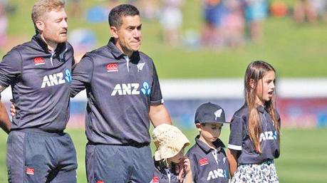 Taylor was joined by his three children when singing the national anthem with his team-mates before the match