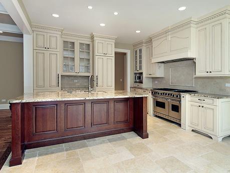 antique_white_kitchen_cabinets_with_dark_granite_countertops