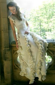A bride wears a knitted wedding dress.