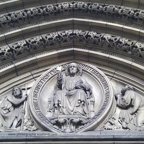 Photo - carvings on the front of a cathedral building