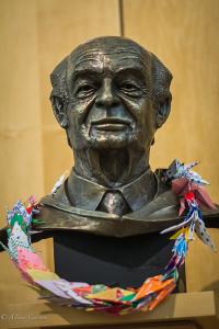 Bust of Pauling with a lei of peace cranes.  Image courtesy of Mina Carson.