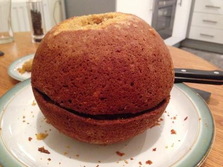 sphere pumpkin cake two halfs together and trimmed into shape