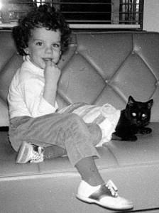 photo of little girl and black cat, circa 1965