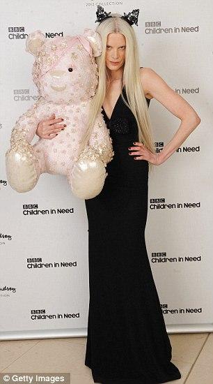 Kristen McMenemy poses with the Alexander McQueen bear she auctioned for £8,500