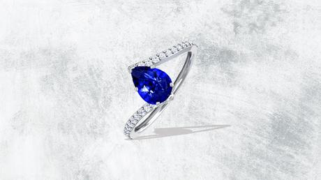 Pear Shape Untreated Blue Sapphire Bypass Ring With Prong Set Round Diamonds