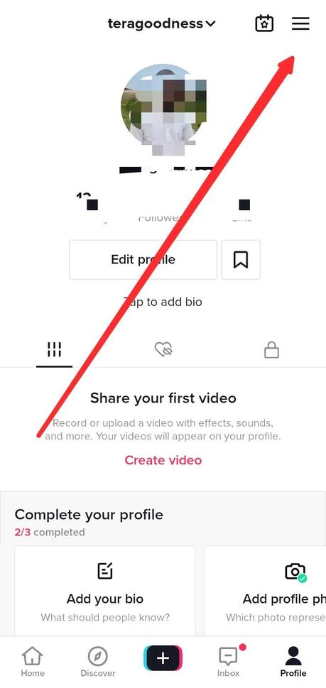 Visit your TikTok profile and open the menu icon