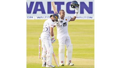 Angelo Mathews celebrates with Dinesh Chandimal after scoring his 12th Test century off 183 balls. (Pic courtesy SLC)