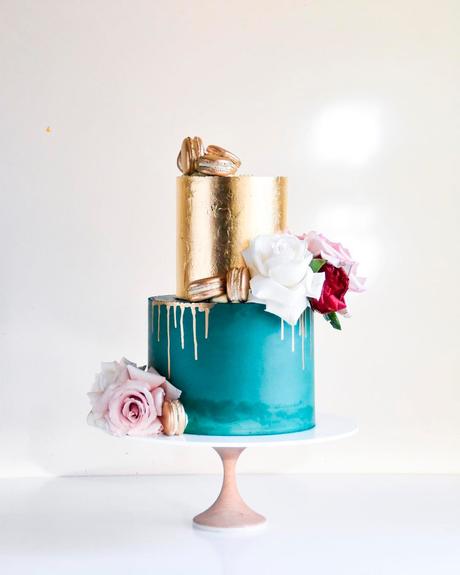 blue and gold wedding theme cake dripped