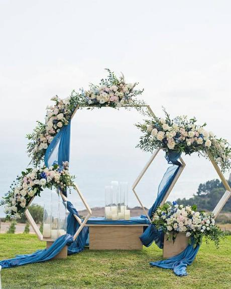 blue and gold wedding theme aisle arch