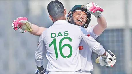 Litton Das embraces Mushfiqur Rahim after reaching his century.