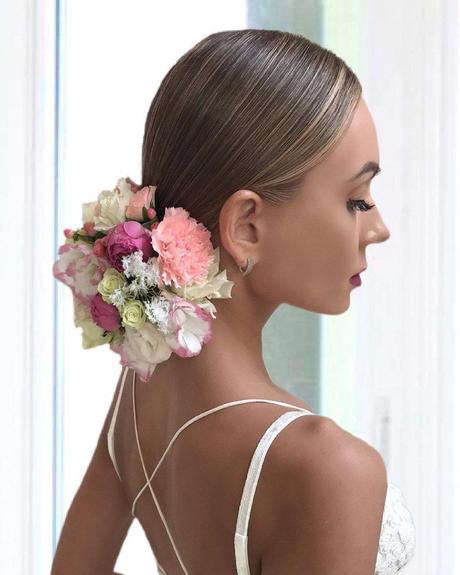 spring wedding hairstyles low bun with flowers art4studio