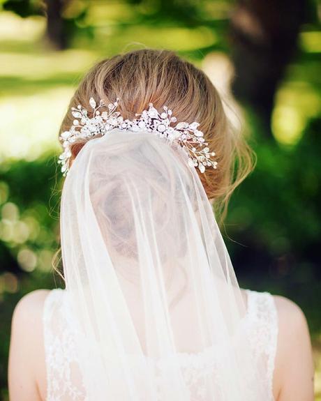 low bun hairstyles for wedding with high veil enzebridal