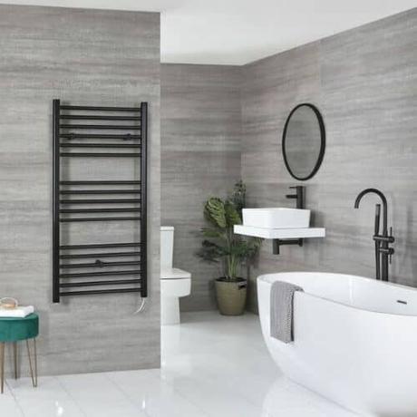 milano nero wall mounted electric heater in a gray bathroom