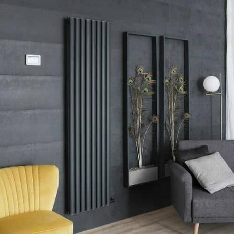 milano aruba ardus electric vertical radiator in a gray living room