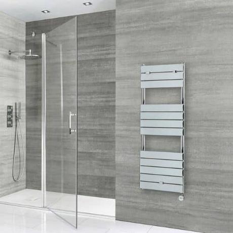 milano lustro chrome wall mounted electric heater in a gray bathroom