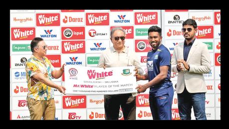 Asitha Fernando receiving the Man of the Match award from Bangladesh Cricket Board (BCB) president Nazmul Hassan.