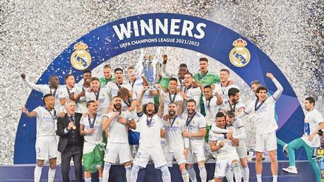 Marcelo lifts the trophy as Real Madrid celebrate their 14th European Cup after victory in Paris.