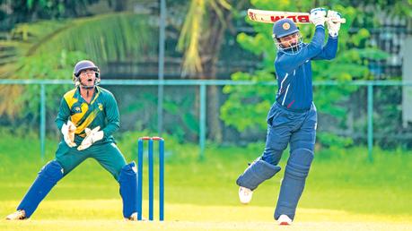 Panadura SC’s Lakshan Rodrigo plays a shot against Nugegoda while wicketkeeper Lisula Lakshan looks on. (Pic courtesy SLC)