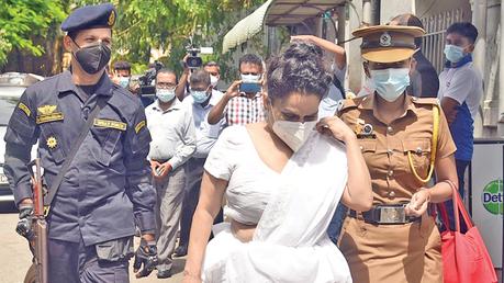 NFF Leader and former Minister Wimal Weerawansa’s wife Shashi Weerawansa who was sentenced to two years Rigorous Imprisonment in relation to a case related to producing false information to obtain a diplomatic passport, arriving at the Colombo Magistrate’s Court accompanied by prison officials for the hearing of her bail application yesterday.  Picture by Samantha Weerasiri