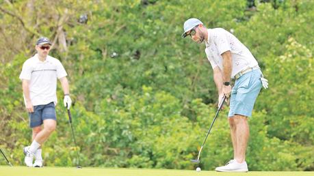 Australia cricketers were busy at playing golf yesterday morning during their free time. Here all rounder Glen Maxwell and Joes Inglis are playing  Golf at Digana Golf course. (Pix courtesy SLC)