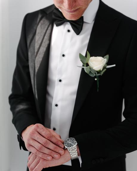 black wedding suit jacket with bow tie bouttonnieres tuxedo nathanwyattphotography