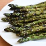 grilled asparagus on white plate