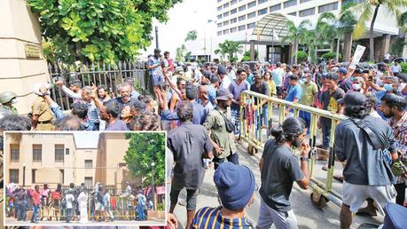 Protesters obstruct normal public life: Protesters obstructing the two entrances on Lotus Mawatha to the Presidential Secretariat and the Finance Ministry in Colombo yesterday. Pictures by Ranjith Asanka and Hirantha Gunetilake