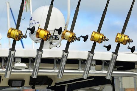 Spinning rods mounted near the GPS antenna of a fishing boat