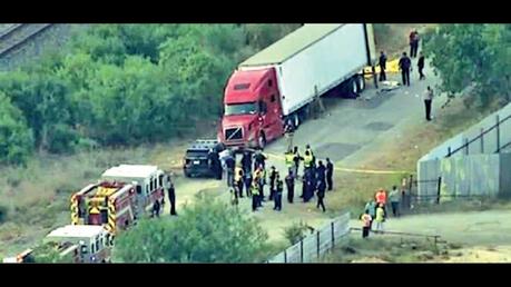 An aerial view of the tractor-trailer rig with suspected migrants was found Monday on a remote back road in Southwest San Antonio on Monday.