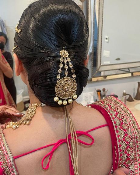 indian wedding hairstyles smooth chignon with pin bridalgal