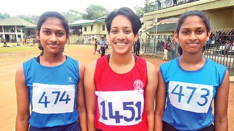 Winners of the Under 18 - 200 Metre Girls- First Seneeka Gunaratne C.I.S. (in the middle), Vidushini Thewanda Vihara Maha Devi,Second (on left) and Vidushinis’twin sister Kewmini Omanja Vihara Maha Devi, third (on right). Pictures by  Upananda Jayasundera Kandy Sports Special Corr   
