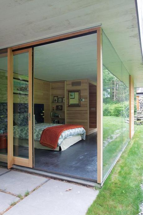 Modern guest bedroom with glass walls 