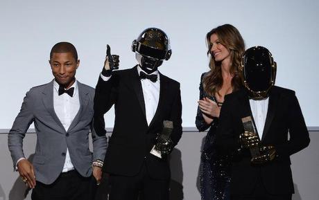 Pharrell Williams and Gisele Bündchen present an award to Daft Punk onstage at the WSJ. Magazine's 'Innovator Of The Year' Awards 2013 at The Museum of Modern Art on November 6, 2013 in New York City