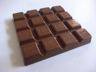 A christmas edition of Ritter Sport containing an orange and caramel flavor cream filling