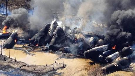 A tanker train carrying crude oil burns after derailing in western Alabama outside Aliceville, early Friday, Nov. 8, 2013. (Bill Castle/AP)