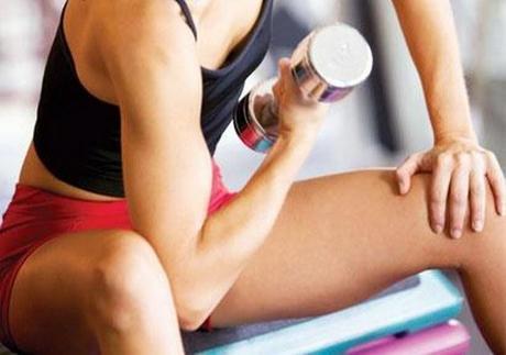 Girl Lifting Weight for fat burning