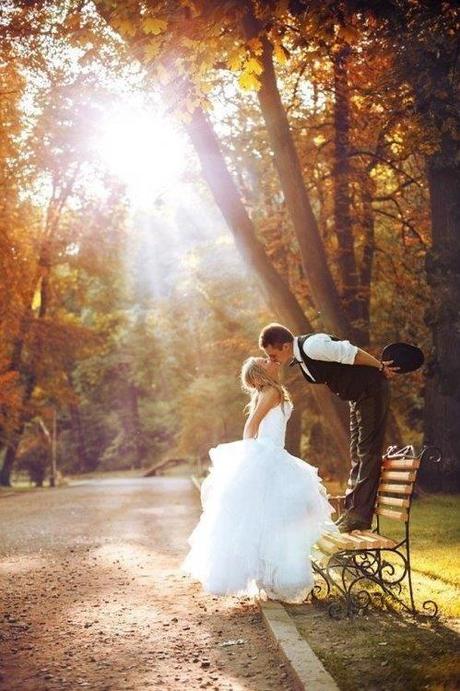 Bride and Groom Kissing in Autumn