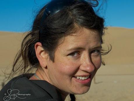 Laurel Robbins covered in sand after sandboarding