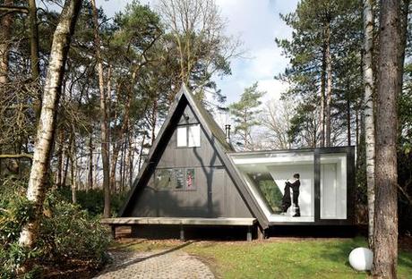 Modern A-frame structure with glass extension in Belgium. 