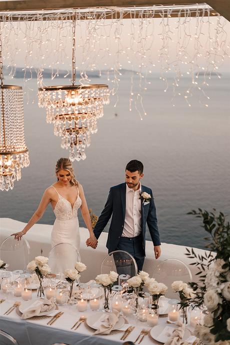 stylish-destination-wedding-santorini-breathtaking-views-romantic-florals_36