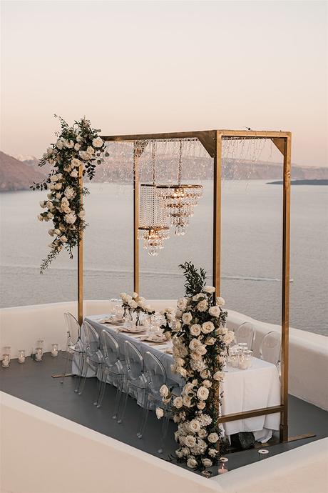 stylish-destination-wedding-santorini-breathtaking-views-romantic-florals_32